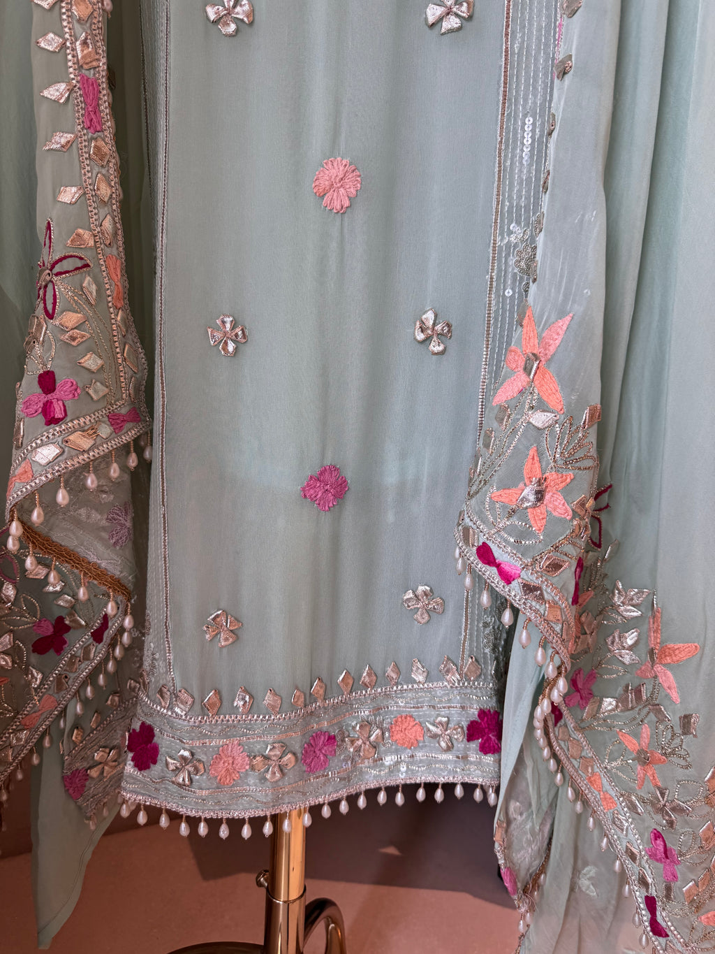 The Gilded Petals — Georgette Suit with Gota & Tassel Work-mint front hem closeup 