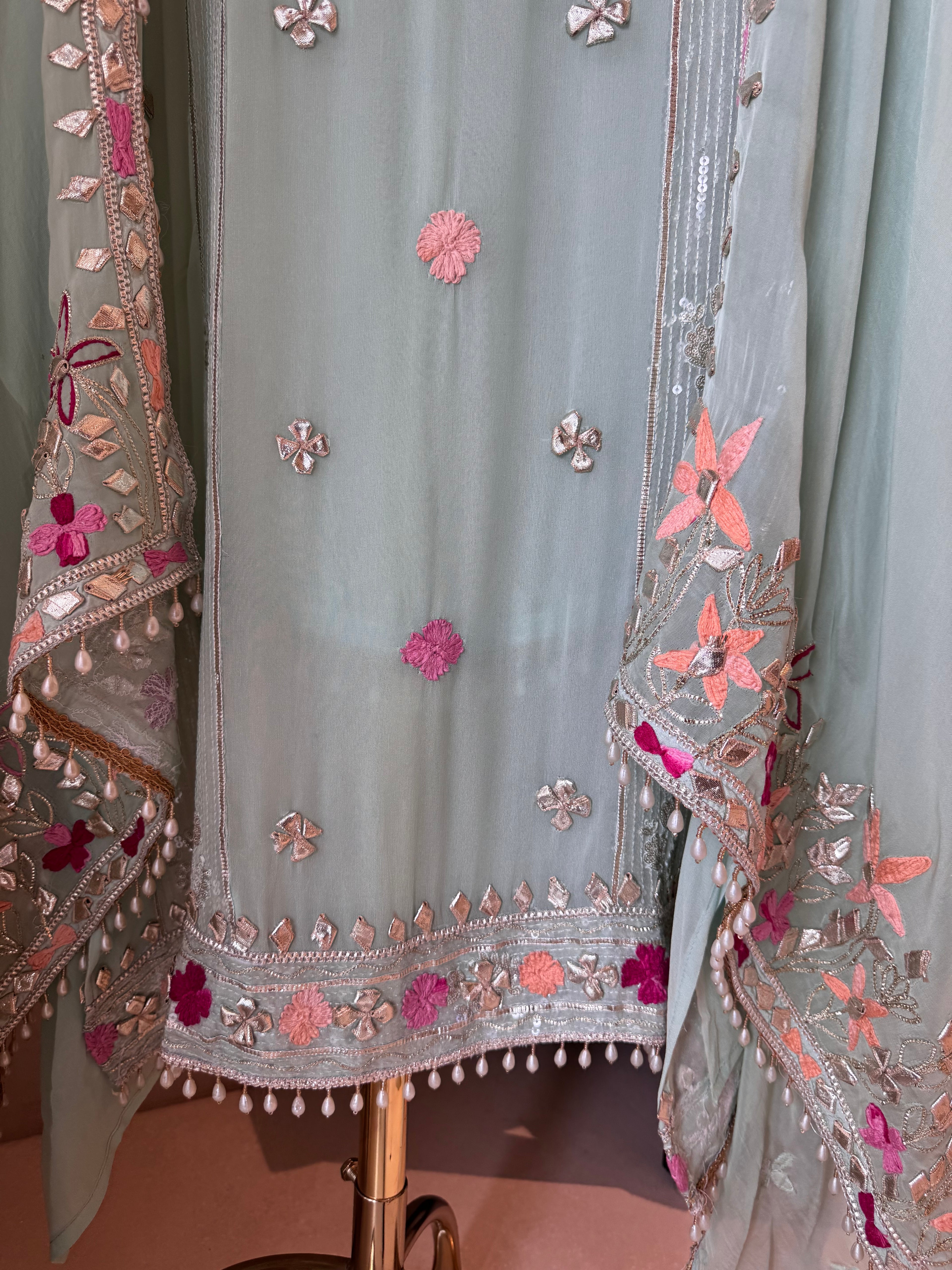 The Gilded Petals — Georgette Suit with Gota & Tassel Work-mint front hem closeup 