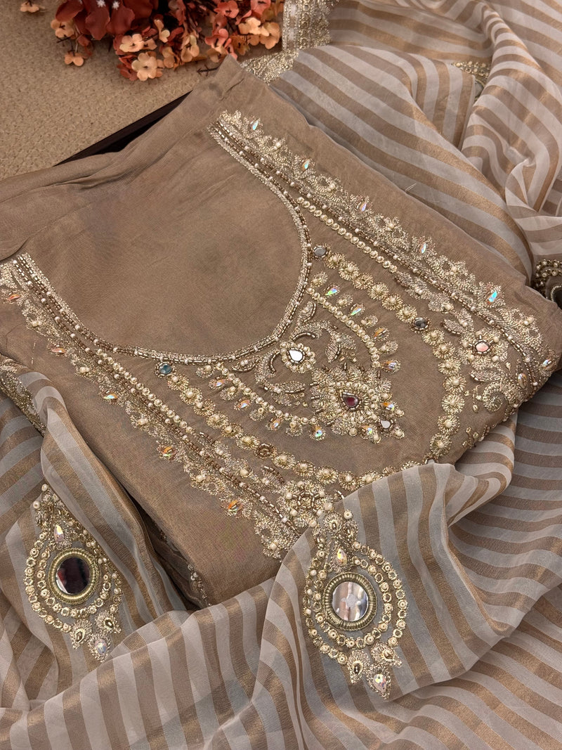 About us — signature Happy Moments handcrafted ethnic suit showcasing intricate embroidery, premium craftsmanship.