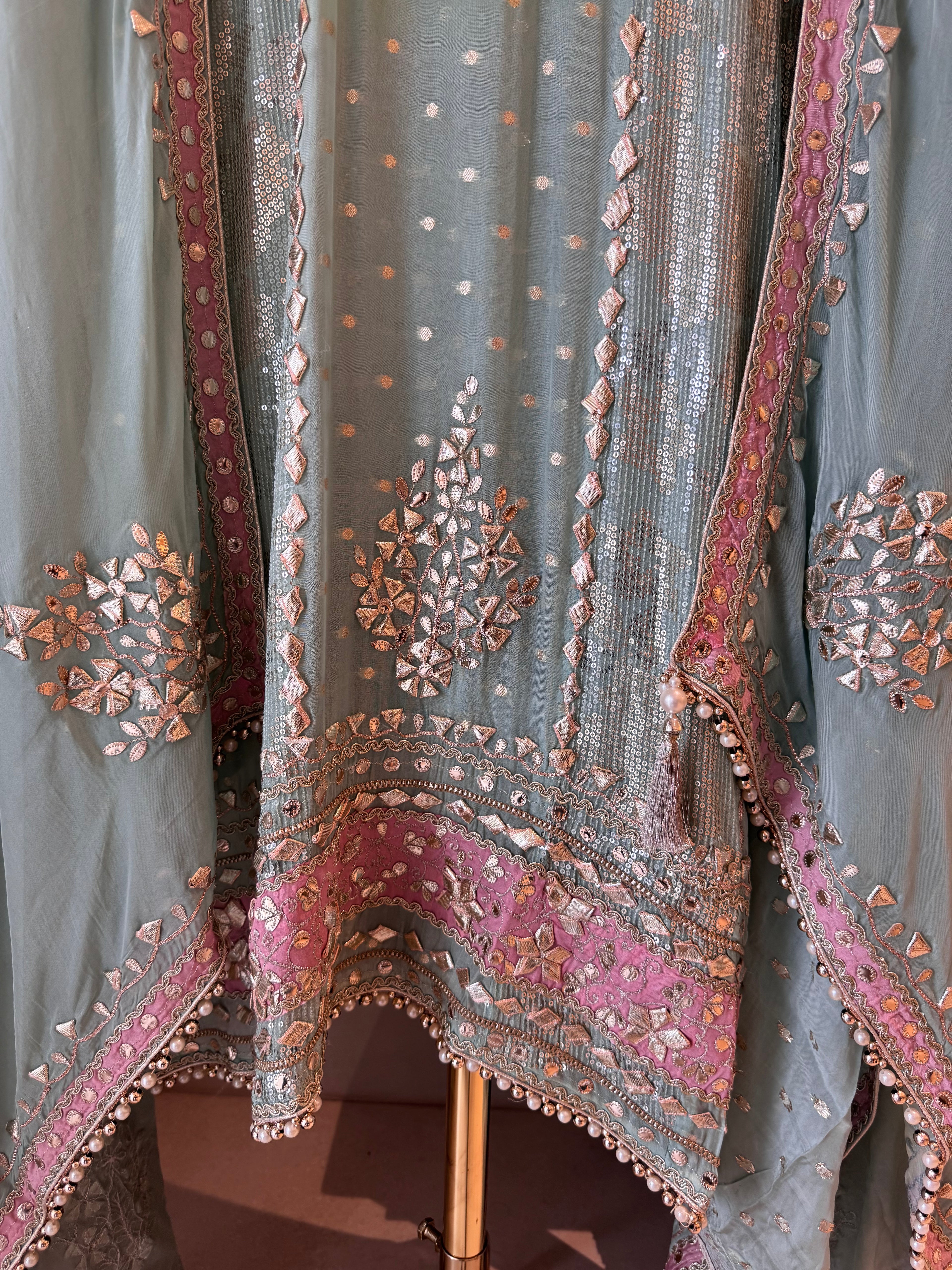 The Gota Tapestry — Organza Suit with Leather Patch Work-sage mint-hem-closeup 